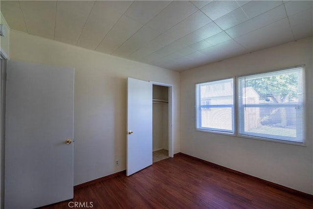 12821 Salisbury St, Baldwin Park, CA 91706 - unfurnished bedroom featuring wood finished floors, a closet, and baseboards