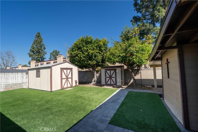 12821 Salisbury St, Baldwin Park, CA 91706 - view of yard featuring a storage shed, a fenced backyard, and an outdoor structure
