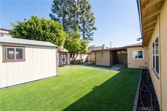 12821 Salisbury St, Baldwin Park, CA 91706 - view of yard with a shed, fence, and an outdoor structure