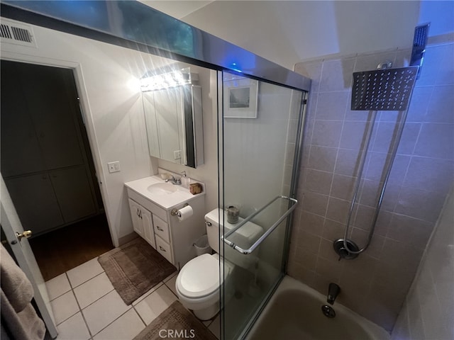 full bath featuring visible vents, vanity, tile patterned floors, toilet, and shower / bathtub combination