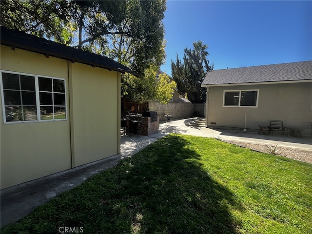 view of yard featuring a patio and fence