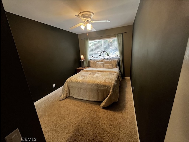 bedroom with baseboards, carpet flooring, a ceiling fan, and visible vents