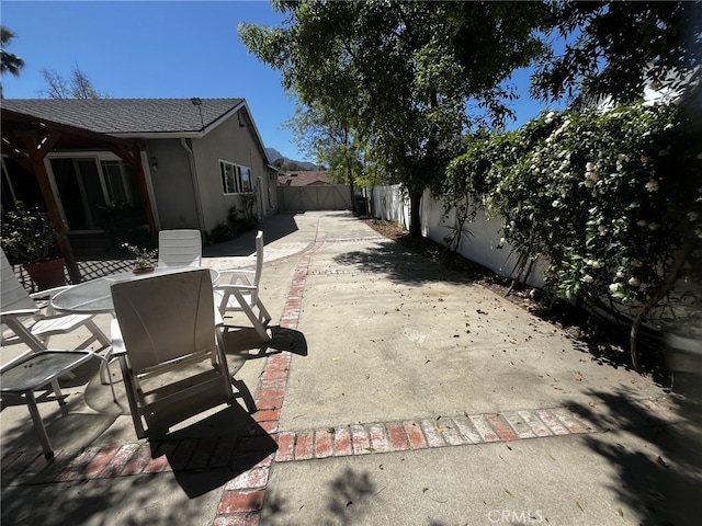 view of patio / terrace with a fenced backyard and outdoor dining space