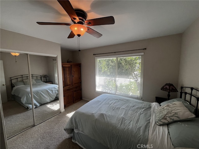 bedroom featuring carpet floors, a ceiling fan, and a closet