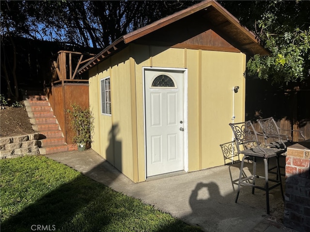 view of shed featuring stairs