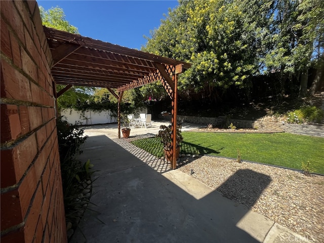 view of patio featuring a fenced backyard and a pergola