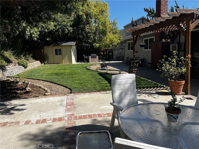 view of yard featuring outdoor dining area, a patio area, fence, an outdoor structure, and a pergola