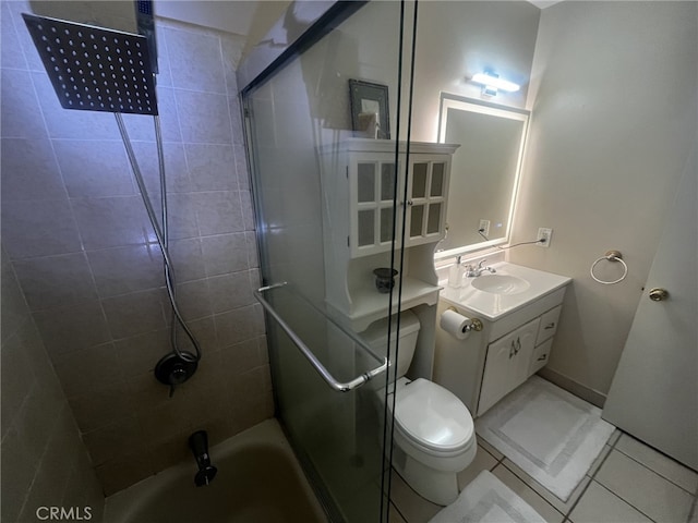 bathroom with toilet, tile patterned flooring, and vanity