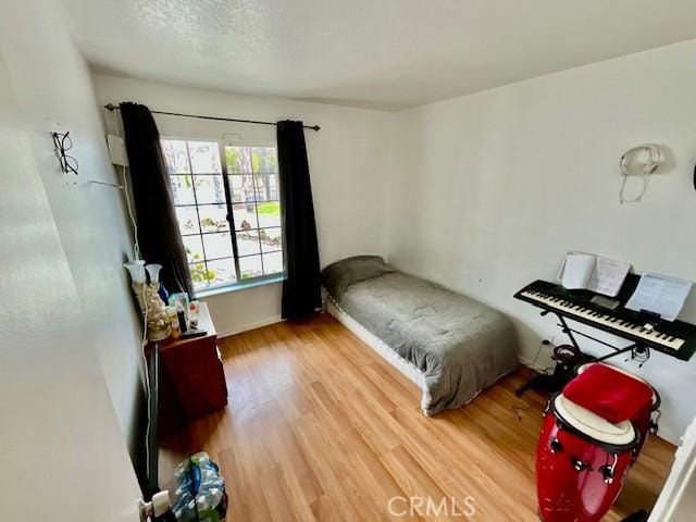 bedroom with wood finished floors