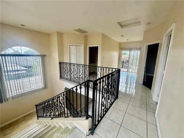 12219 S Main St, Los Angeles, CA 90061 - stairway with attic access and tile patterned flooring
