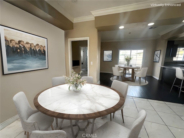 dining room with a wealth of natural light, visible vents, ornamental molding, and light tile patterned flooring