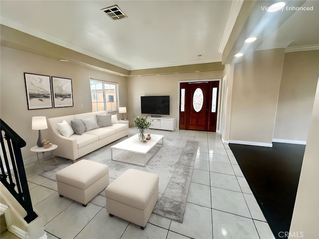 living area with visible vents, ornamental molding, and baseboards