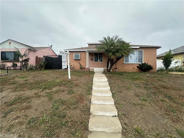 12219 S Main St, Los Angeles, CA 90061 - bungalow-style home featuring stucco siding