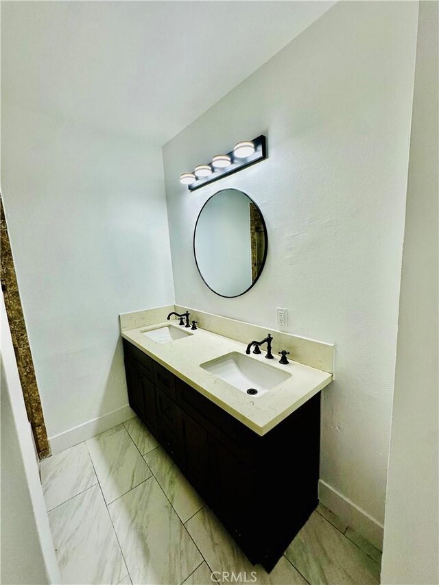 12219 S Main St, Los Angeles, CA 90061 - full bath with baseboards and double vanity