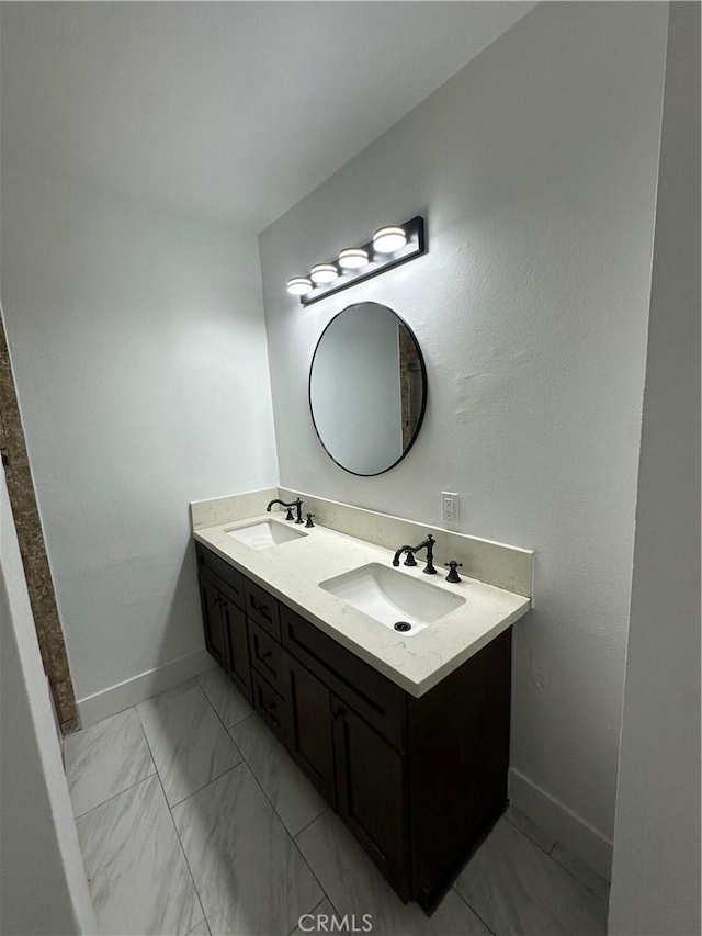 12219 S Main St, Los Angeles, CA 90061 - full bathroom featuring double vanity and marble finish flooring