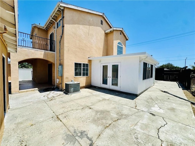 12219 S Main St, Los Angeles, CA 90061 - rear view of property with french doors, stucco siding, a patio, and a balcony