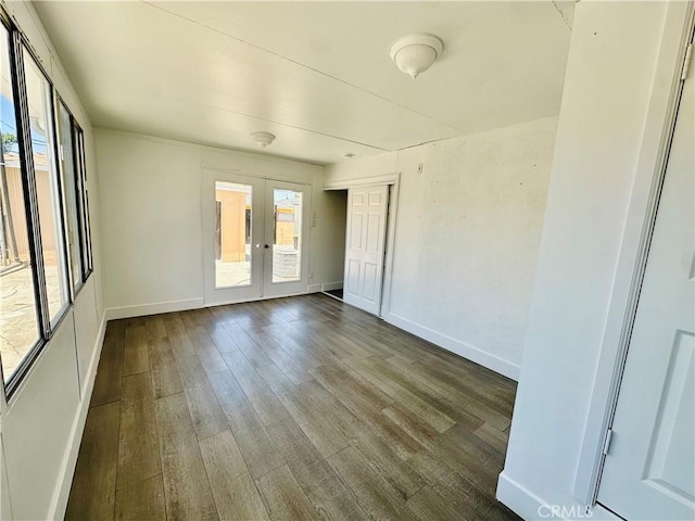 12219 S Main St, Los Angeles, CA 90061 - empty room with french doors and dark wood-style floors
