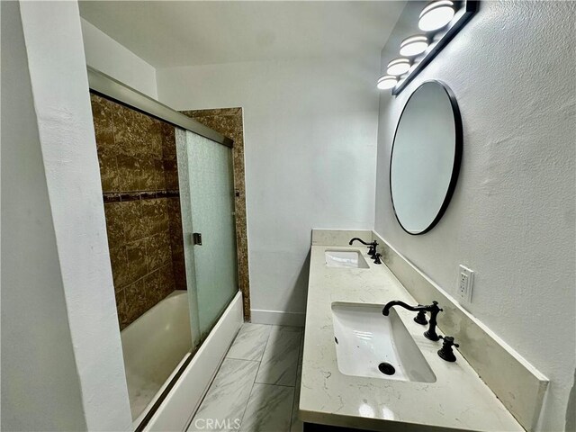 12219 S Main St, Los Angeles, CA 90061 - full bathroom with double vanity, enclosed tub / shower combo, and marble finish flooring