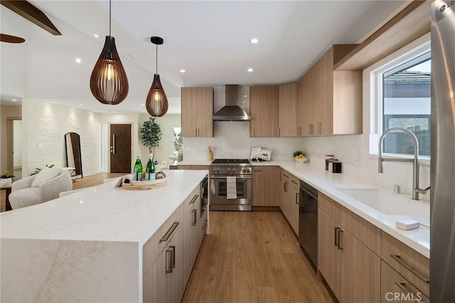 5306 Maricopa St, Torrance, CA 90503 - kitchen featuring high end stainless steel range, wall chimney exhaust hood, dishwasher, light brown cabinetry, and light wood-style floors