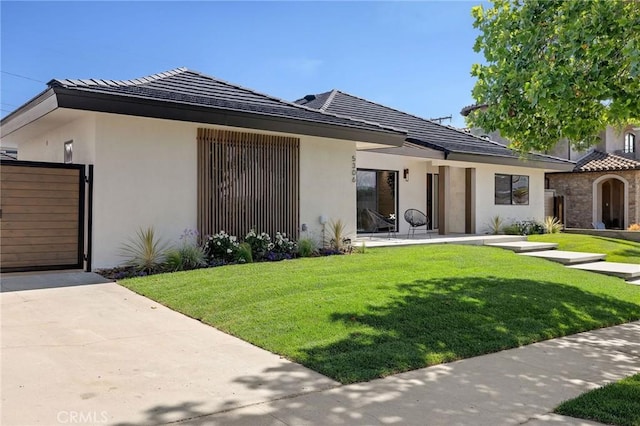 5306 Maricopa St, Torrance, CA 90503 - view of front of house featuring a front yard and stucco siding