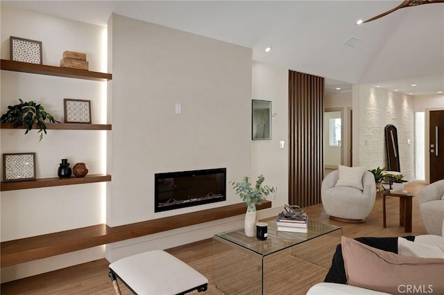 5306 Maricopa St, Torrance, CA 90503 - living room featuring wood finished floors, a glass covered fireplace, recessed lighting, and a ceiling fan