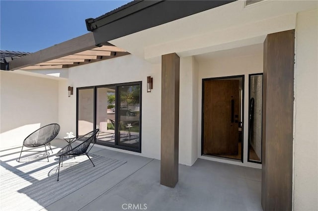 5306 Maricopa St, Torrance, CA 90503 - doorway to property with stucco siding and a patio