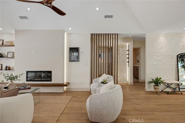 5306 Maricopa St, Torrance, CA 90503 - living room featuring a glass covered fireplace, a ceiling fan, light wood-type flooring, and recessed lighting