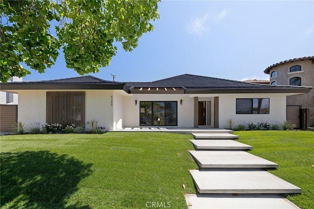 5306 Maricopa St, Torrance, CA 90503 - view of front facade featuring stucco siding, a front lawn, and a tiled roof