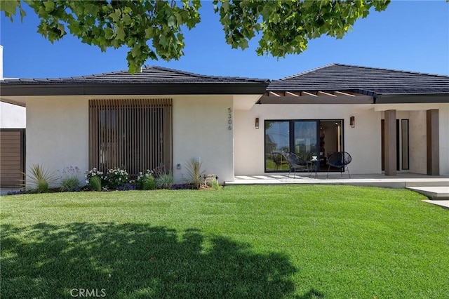 5306 Maricopa St, Torrance, CA 90503 - back of property with stucco siding, a lawn, and a patio