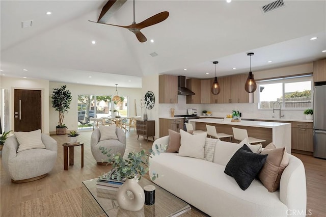 5306 Maricopa St, Torrance, CA 90503 - living area with recessed lighting, high vaulted ceiling, a ceiling fan, light wood finished floors, and beamed ceiling