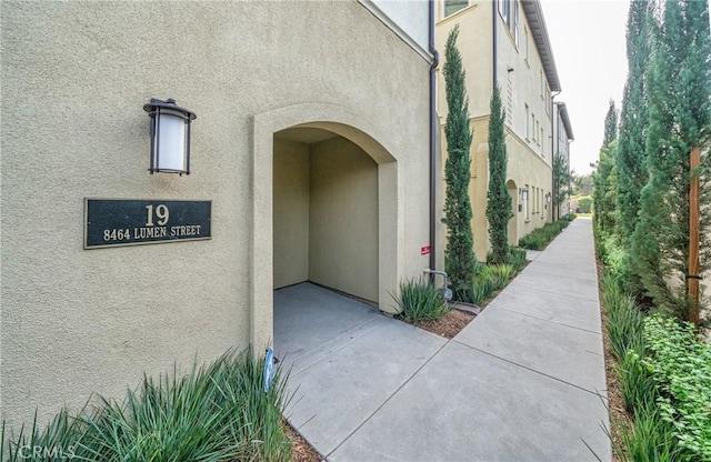 doorway to property with stucco siding