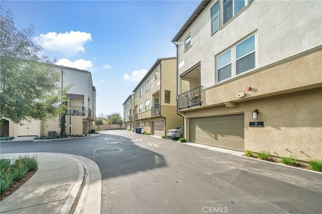 view of road featuring a residential view, curbs, and sidewalks