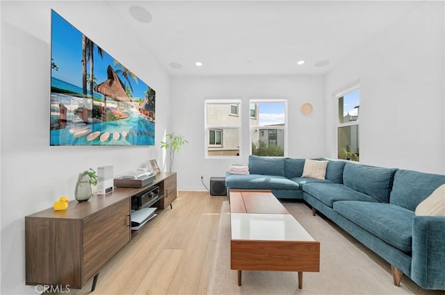 living room featuring light wood finished floors and recessed lighting