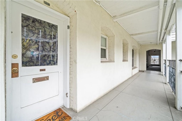 property entrance featuring stucco siding