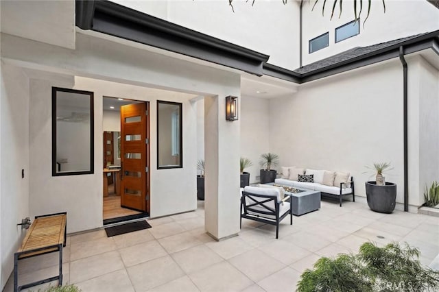 view of patio featuring an outdoor living space with a fire pit