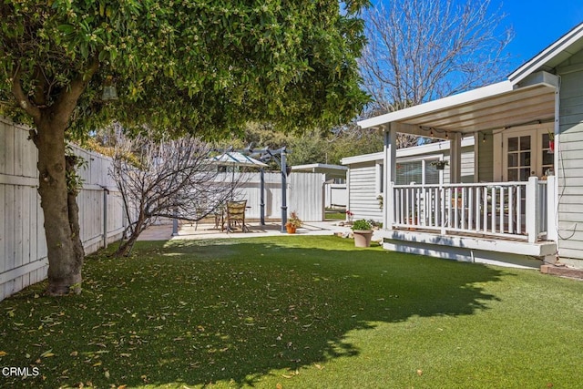 view of yard with fence and a patio