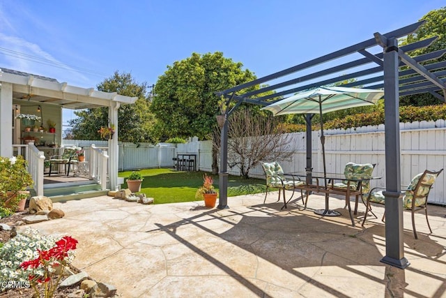 view of patio / terrace with fence, outdoor dining space, and a pergola