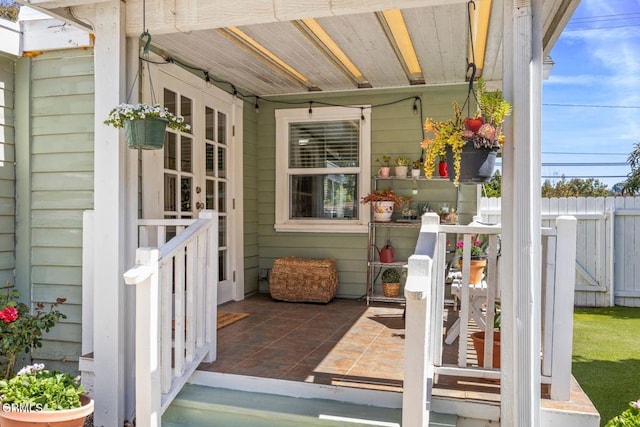 view of patio / terrace featuring fence