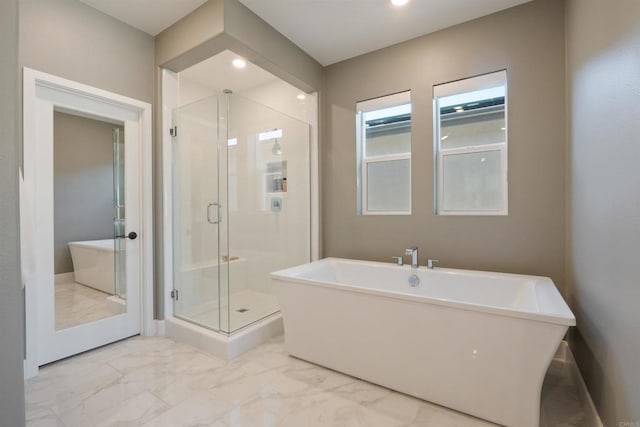 15751 Wainwright Way, San Diego, CA 92127 - full bathroom featuring marble look tiles, a shower stall, a soaking tub, and recessed lighting