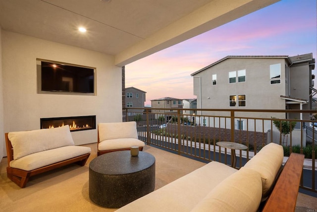 15751 Wainwright Way, San Diego, CA 92127 - balcony at dusk featuring an outdoor living space with a fireplace
