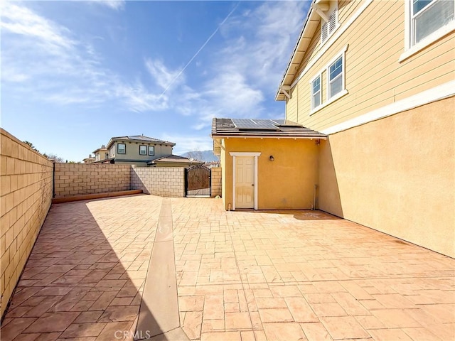 view of patio with a gate and a fenced backyard
