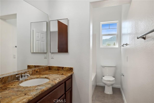 bathroom featuring baseboards, toilet, tile patterned floors, vanity, and shower / bathing tub combination