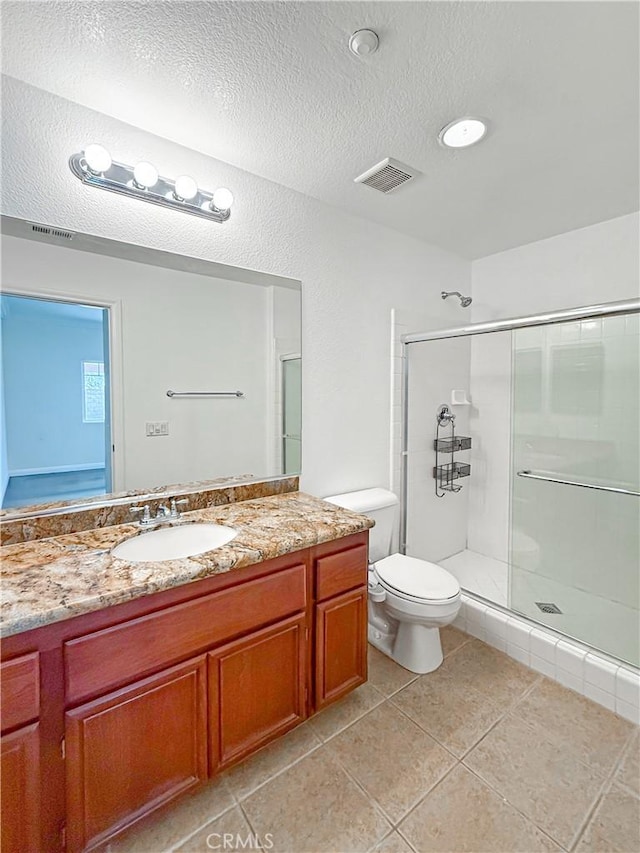full bath with visible vents, a textured ceiling, toilet, and a stall shower