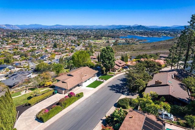 aerial view featuring a residential view and a water and mountain view