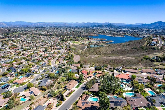 bird's eye view with a residential view and a water and mountain view