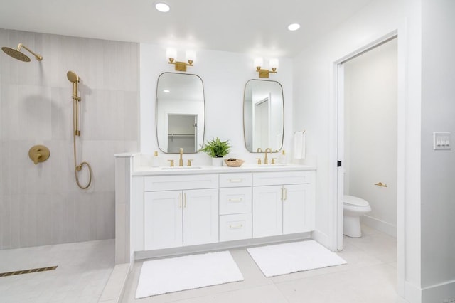 full bath featuring a sink, a walk in shower, and toilet