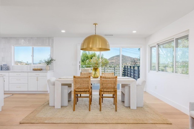 dining area with recessed lighting, visible vents, and light wood finished floors