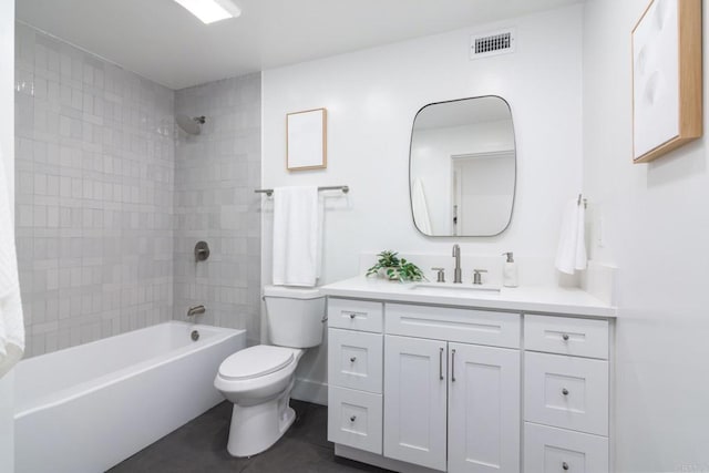 bathroom with visible vents, tile patterned flooring, vanity, toilet, and washtub / shower combination