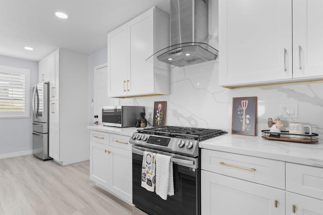 7162 Beagle St, San Diego, CA 92111 - kitchen with wall chimney range hood, stainless steel appliances, light stone countertops, white cabinetry, and light wood-style floors