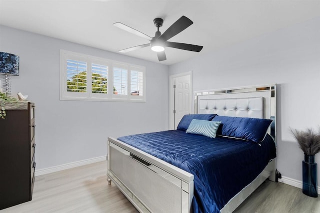 7162 Beagle St, San Diego, CA 92111 - bedroom featuring light wood-style floors, baseboards, and a ceiling fan